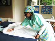 Student learning to fold sheets